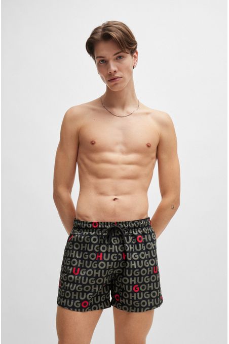 PANTALONETAS DE BAÑO TIPO SHORTS CON LOGO ESTAMPADO HOMBRE