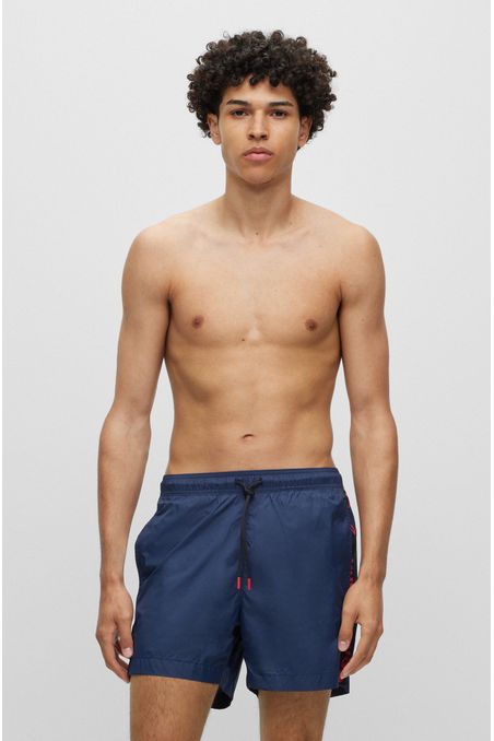 TRAJE DE BAÑO TIPO SHORTS CON CINTA DE LOGOS HOMBRE