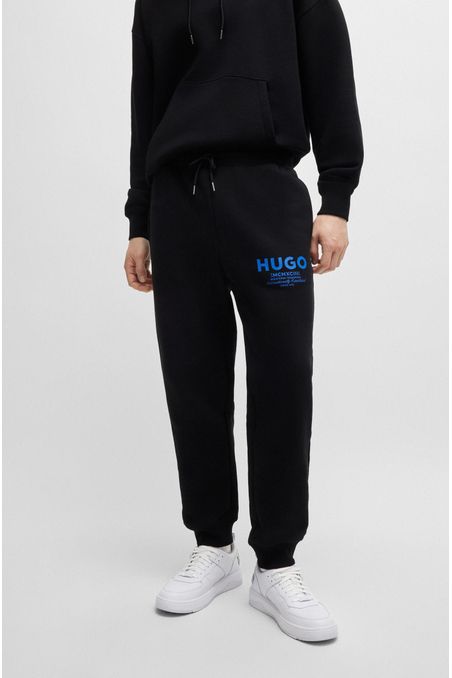 PANTALONES DE SUDADERA OVERSIZE FIT EN FELPA DE ALGODÓN CON LOGO ESTAMPADO HOMBRE