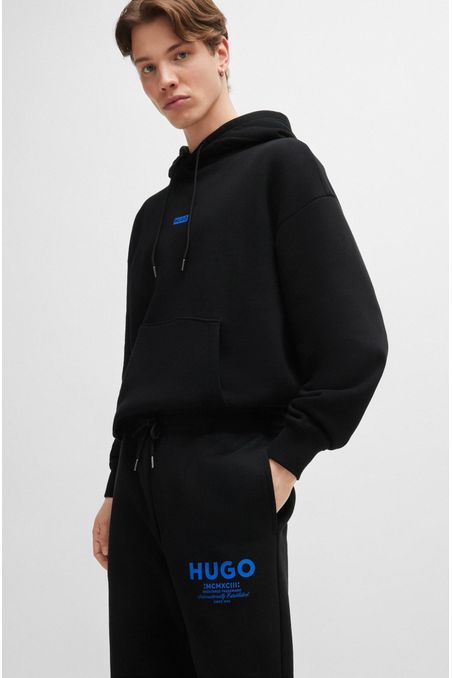 PANTALONES DE SUDADERA OVERSIZE FIT EN FELPA DE ALGODÓN CON LOGO ESTAMPADO HOMBRE