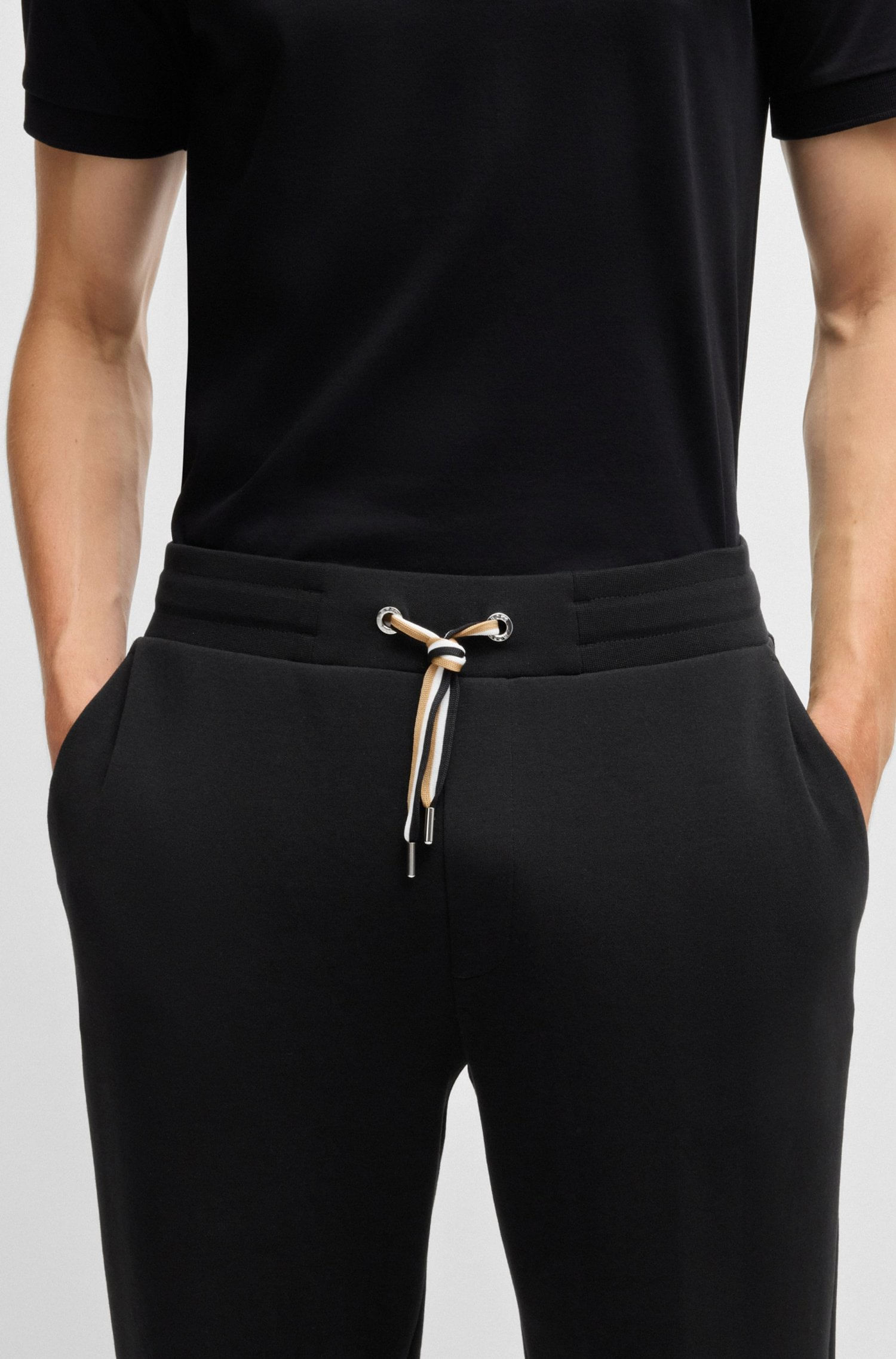 PANTALONES DE SUDADERA REGULAR FIT DE ALGODÓN CON CORDÓN A RAYAS DE LA MARCA HOMBRE