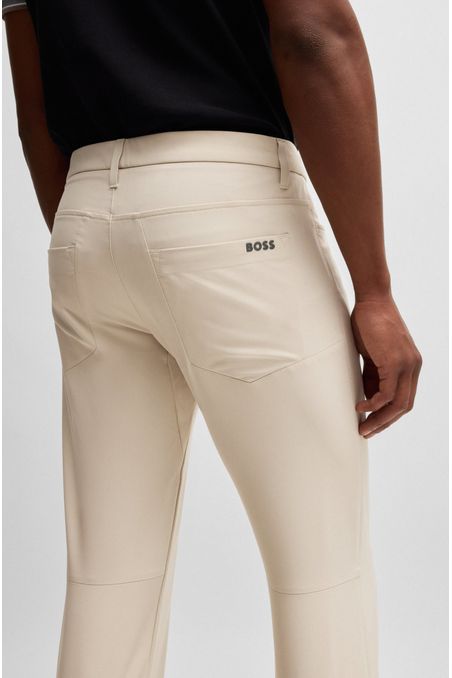 PANTALONES SLIM FIT EN TELA ELÁSTICA REPELENTE AL AGUA HOMBRE